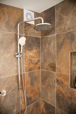 Bathtub, hair dryer, towels, soap