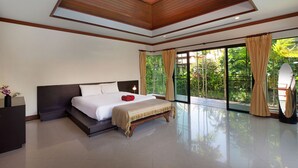 A spacious bedroom with a large bed, a wooden ceiling, and a view of lush greenery through large windows. - Boutique 3BR Pool Villa Bianca NaiHarn (Rawai)
