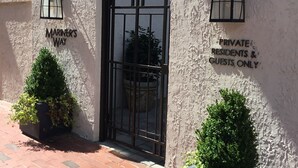 A gated entrance with a sign reading "PRIVATE RESIDENTS & GUESTS ONLY."