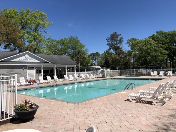 A pool area with lounge chairs and a building labeled "HICKORY POOL". - SLEEPS 10!  3 bedrms/3 baths/Pier House. One Golf Cart incl. 2nd Cart available (Garden City)