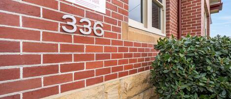 A brick building with a sign reading 'Park on Park' and the number 336.