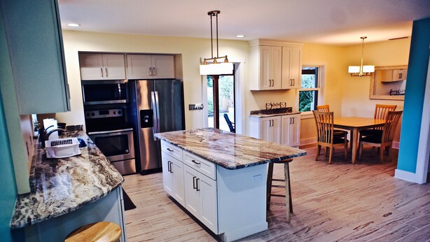 A modern kitchen with granite countertops, stainless steel appliances, and a central island. - 1st Street, Cedar Beach Retreat (Saint Augustine)