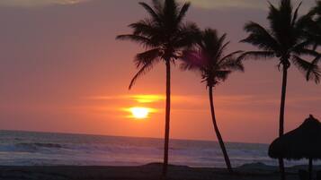 On the beach, sun loungers, beach towels