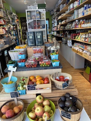 Fresh produce and kitchen essentials on display at this well-stocked grocery store.