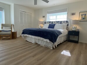 A bedroom with a bed, a chair, a nightstand, and a window with blinds. - Grayton Favorite, Large Private Pool, 75 Yards to Beach Access, Newly Renovated (Santa Rosa Beach)