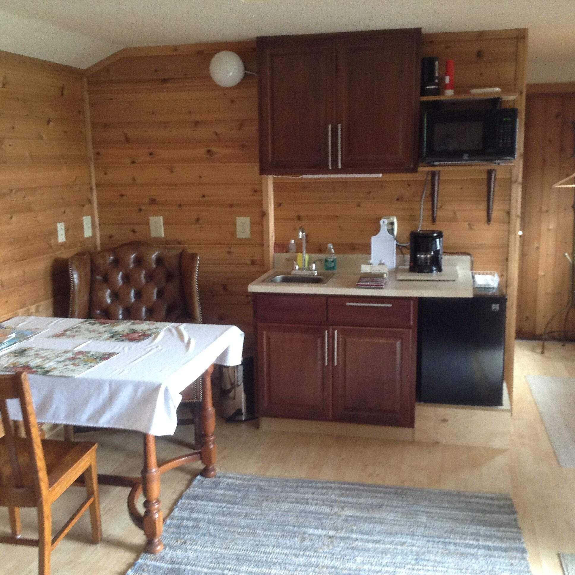 Fridge, microwave, coffee/tea maker, cookware/dishes/utensils