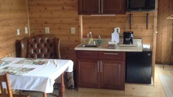Fridge, microwave, coffee/tea maker, cookware/dishes/utensils