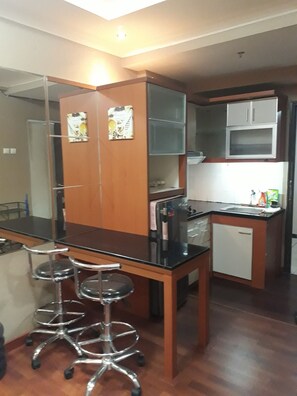 Fridge, stovetop - Apartment The Suites Metro by Herlan (Bandung)
