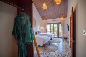 Family Room, Garden View | Minibar, in-room safe, desk, blackout drapes