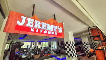 A restaurant named "Jeremy's Kitchen" with a checkered floor pattern and a modern interior design.