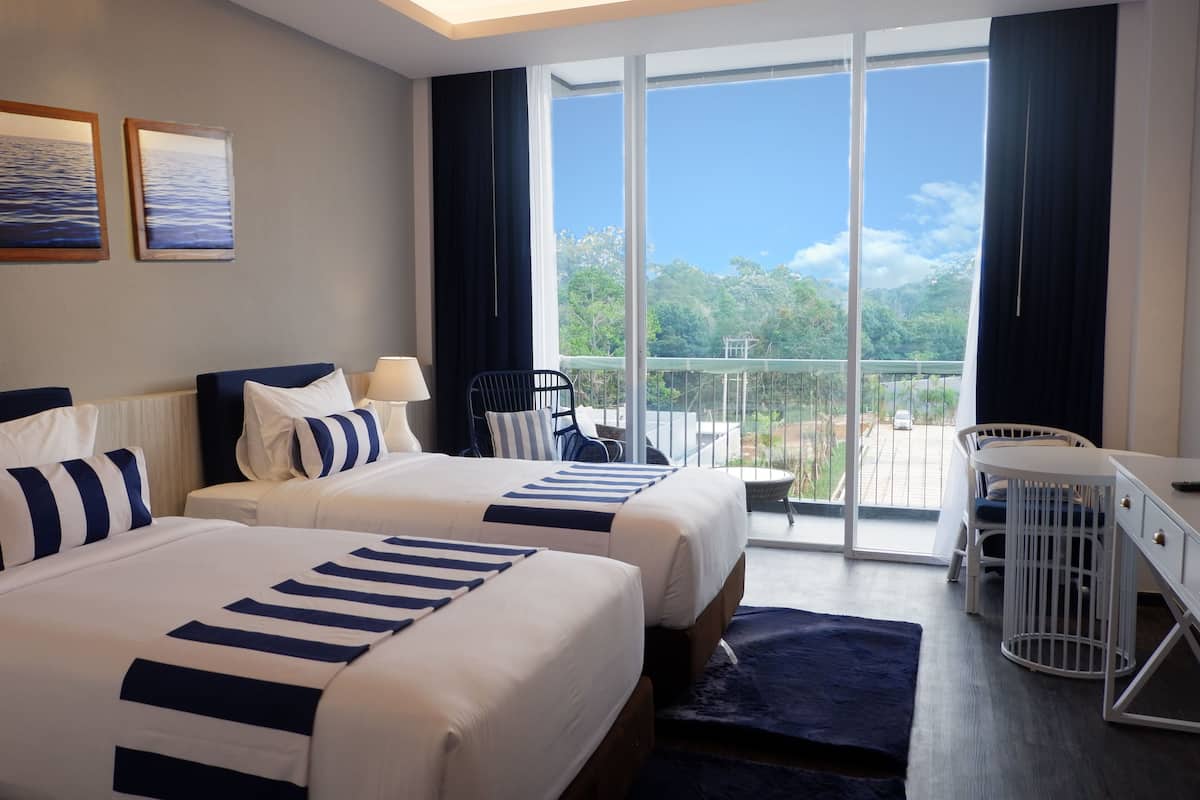 deluxe twin garden view | minibar, in-room safe, desk, free wifi