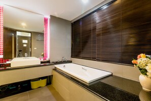 Classic Studio Suite, 1 Queen Bed, Partial Ocean View | Bathroom | Separate bathtub and shower, deep-soaking bathtub, free toiletries - The Kris BangTao by Lofty (Choeng Thale)