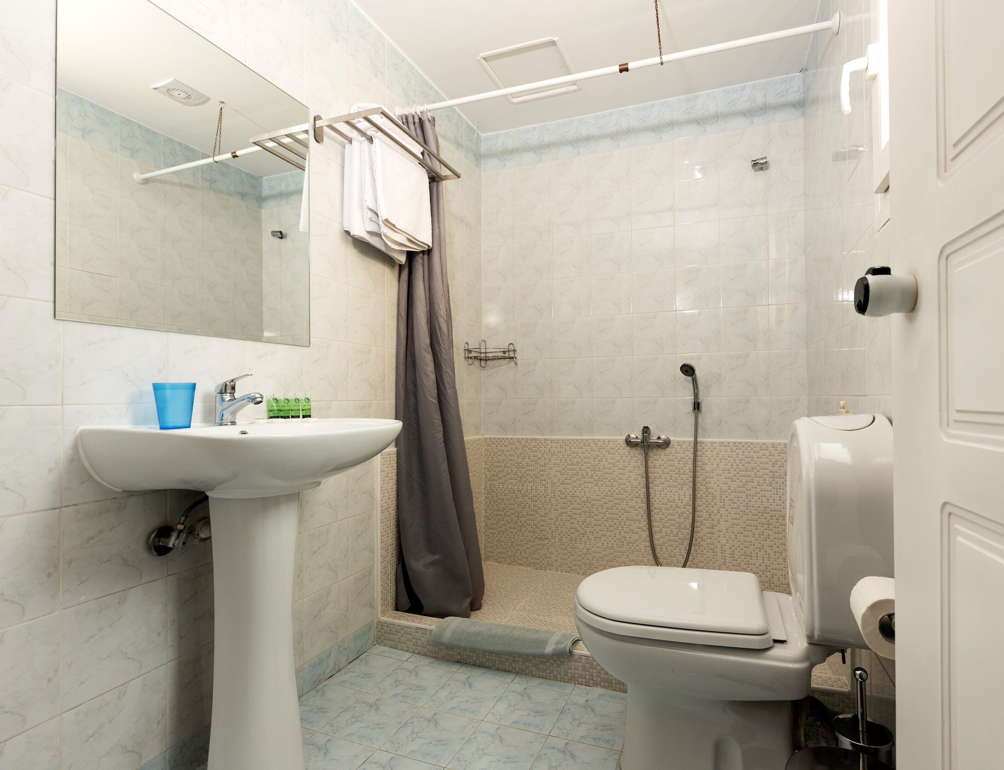 quadruple room | bathroom | shower, free toiletries, hair dryer, towels