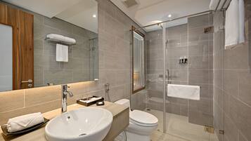 Designer toiletries, hair dryer, slippers, bidet