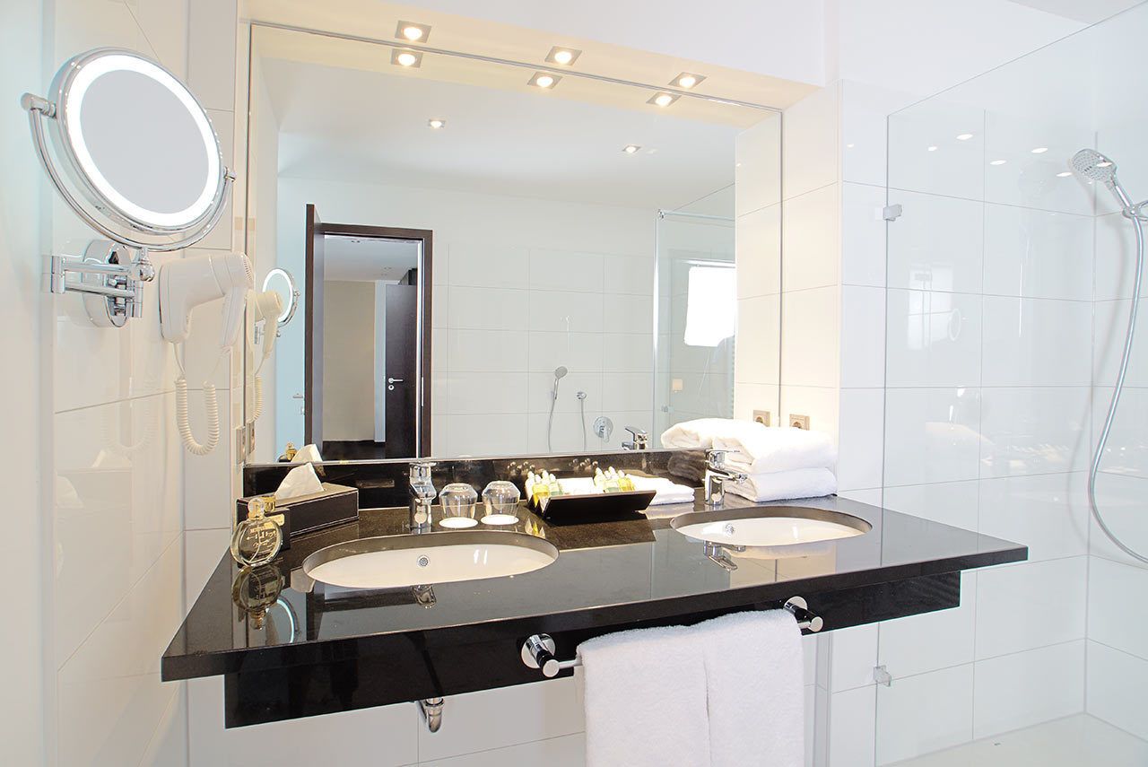 shower, hair dryer, slippers, towels