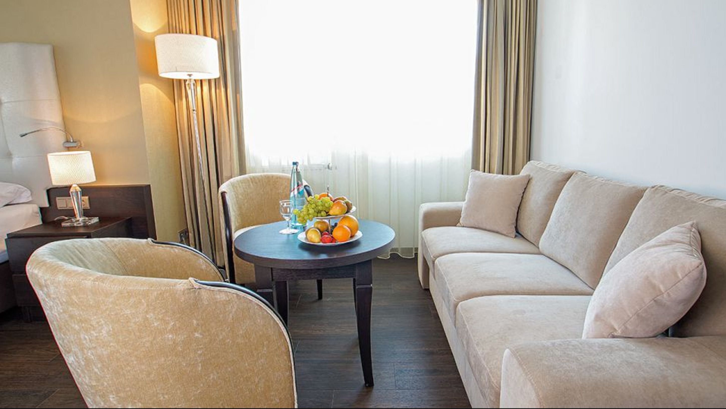 superior double room | living area | flat-screen tv