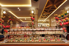 A buffet with various food items and desserts, including fruit skewers and sandwiches. - MS Esmeralda Nile Cruise from Aswan or Luxor (Luxor)