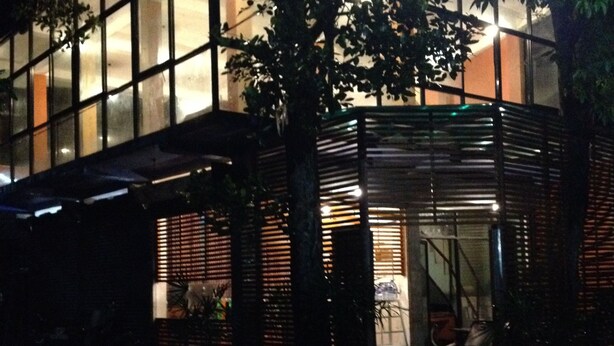 A modern building with large windows and a covered entrance area. - Cinnamon Airport Residencies (Seeduwa - Katunayake)
