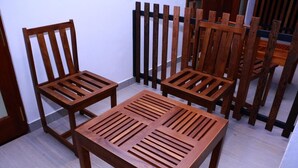 A room with a wooden table and four chairs.