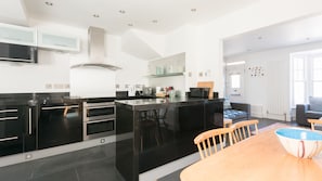 Full-sized fridge, microwave, dishwasher, cookware/dishes/utensils