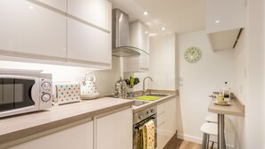 Full-size fridge, microwave, dishwasher, cookware/dishes/utensils - The Burrow, Fabulous Studio Apartment in Central St Ives Location. Free Wifi (St Ives)