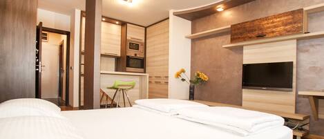 Departamento | Tabla de planchar con plancha, cunas gratuitas y camas extra