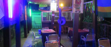 A restaurant with tables and chairs arranged for dining.