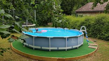 Seasonal outdoor pool, open 2:30 PM to 7:30 PM, pool loungers