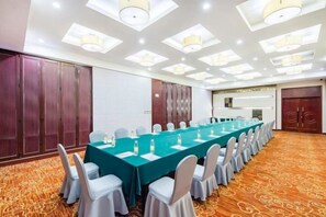 A conference room with a long table, chairs, and a carpeted floor. - Taishan Royal Hotel (Tai'an)