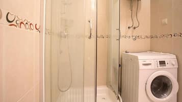 Apartment, 2 Bedrooms | Bathroom | Shower, free toiletries, hair dryer, towels