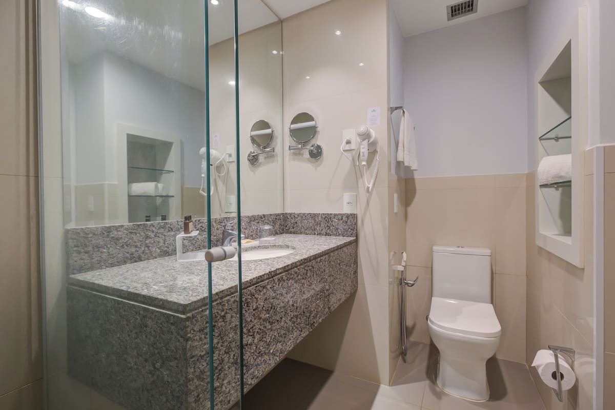 shower, rainfall showerhead, eco-friendly toiletries, towels