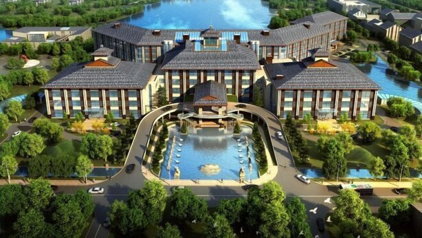 A modern hotel complex with a central courtyard, a swimming pool, and a river view. - Shengyuan International Hotel (ZIBO)