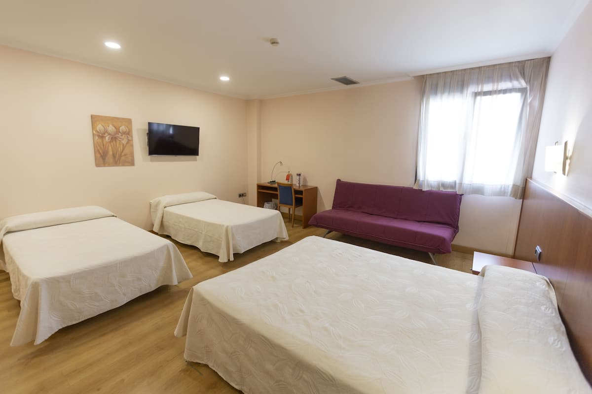 family room | desk, laptop workspace, soundproofing, free cots/infant beds