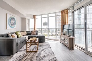 Family Apartment, 2 Bedrooms, Balcony, Lake View | Living area | 53-inch flat-screen TV with cable channels, TV, Netflix - Elegant Downtown Apartments (Toronto)
