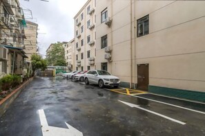 A multi-story parking garage with several cars parked.