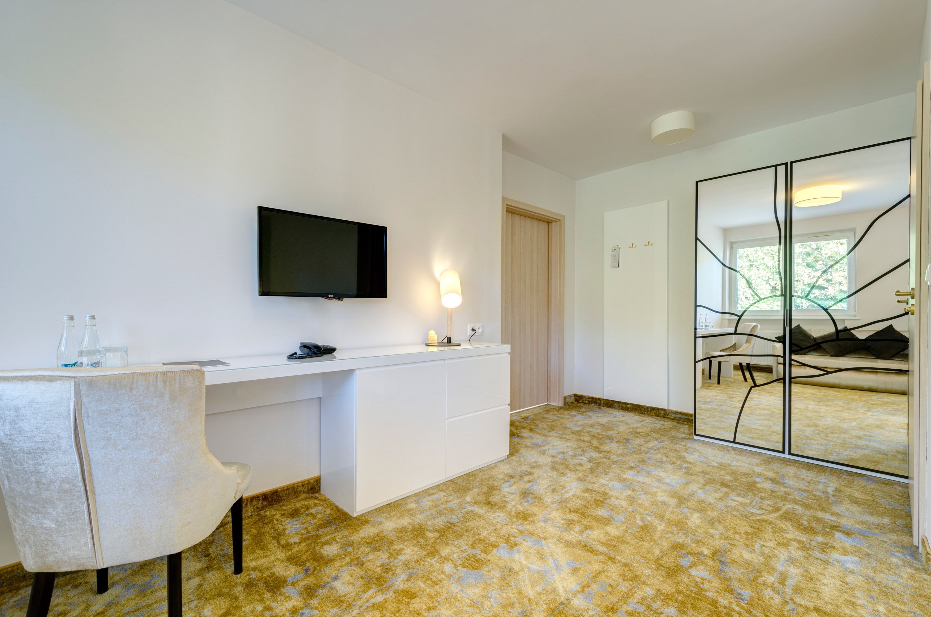 family room | in-room safe, desk, blackout curtains, iron/ironing board