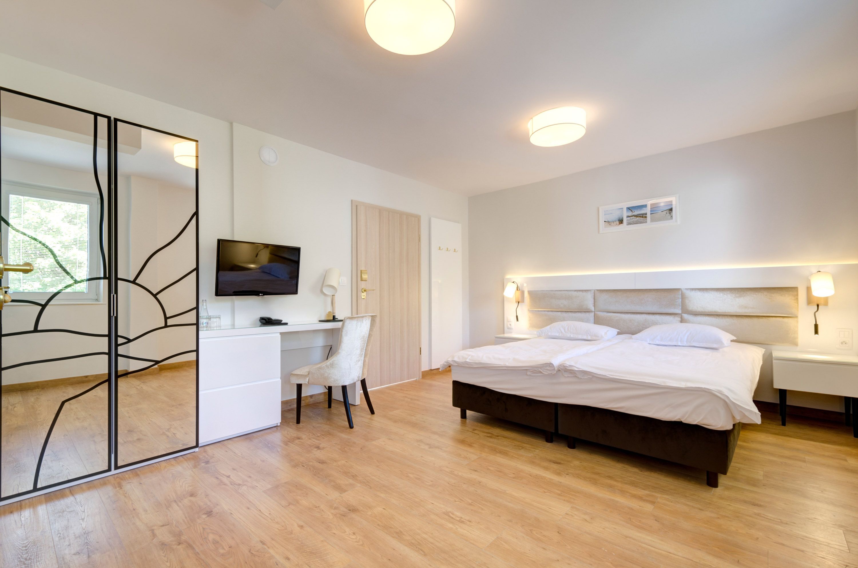 family room | in-room safe, desk, blackout curtains, iron/ironing board