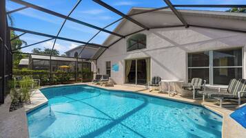 Outdoor pool, a heated pool, sun loungers