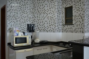 Fridge, microwave, stovetop, coffee/tea maker