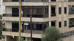 A multi-story building with balconies, large windows, and solar panels on the roof. - Apartment in Jdeideh Beirut (Jdeideh)