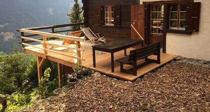 Outside: chalet for 7 people in the heights of St-Luc, terrace with garden furniture -Interior: appr