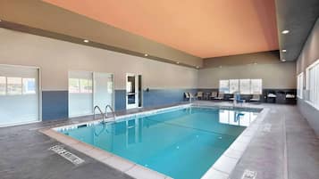 Indoor pool, open 8:00 AM to 10:00 PM, pool loungers