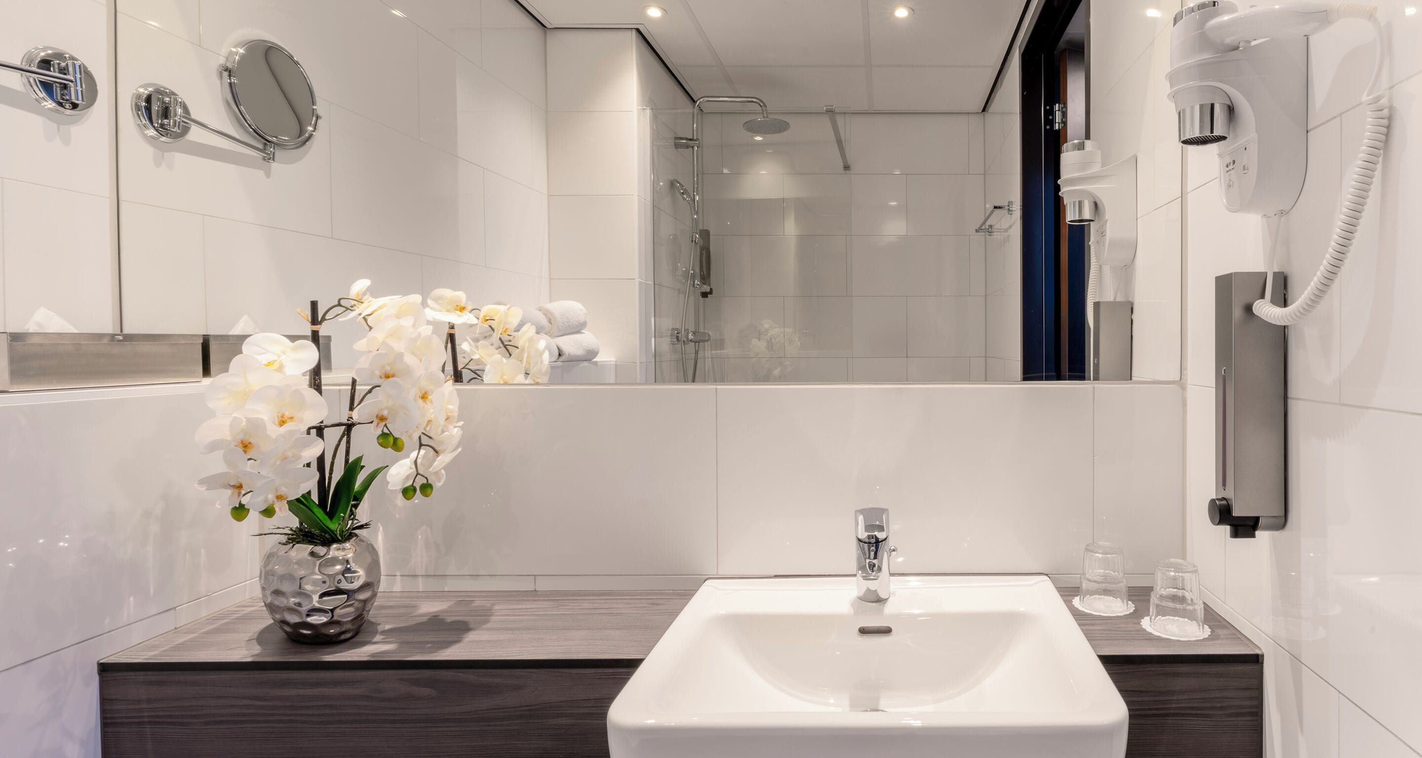 shower, rainfall showerhead, hair dryer, towels