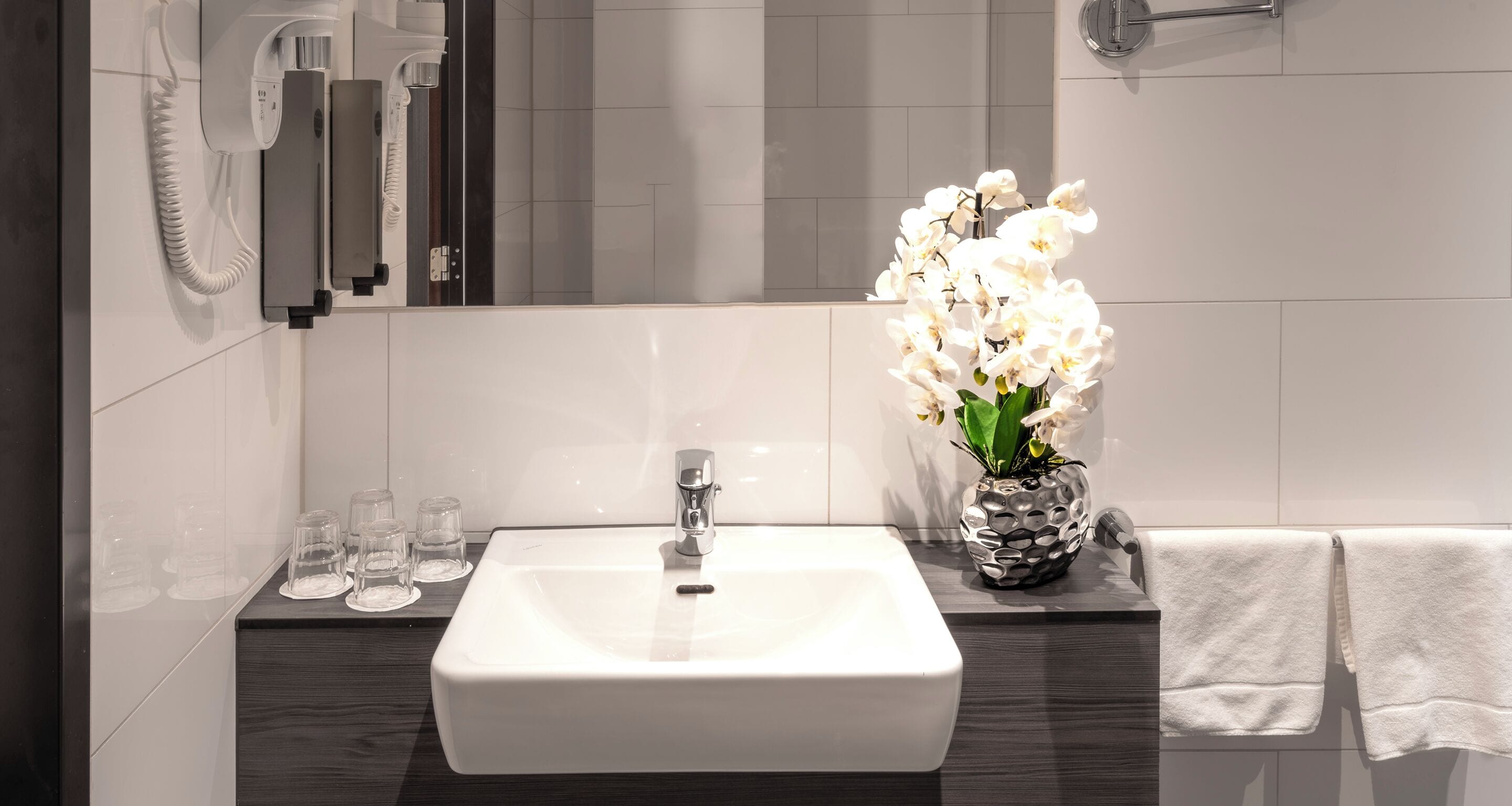 family room | bathroom | shower, rainfall showerhead, hair dryer, towels