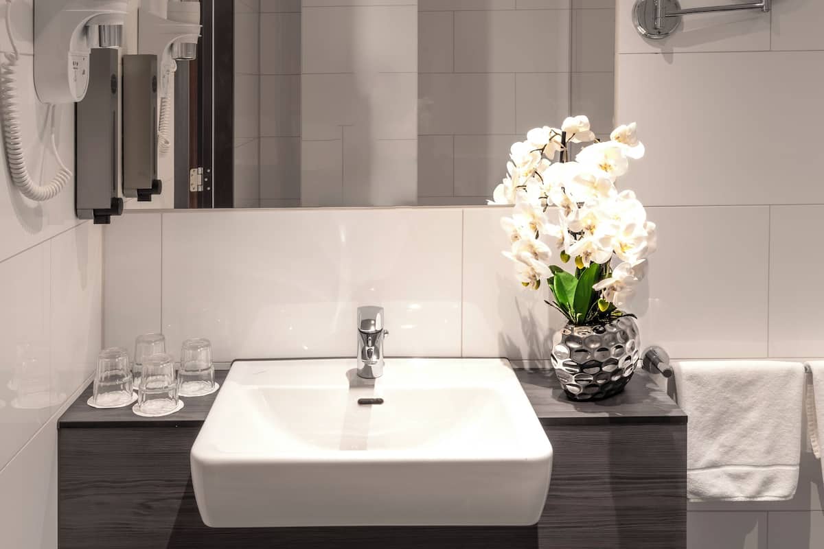 family room | bathroom | shower, rainfall showerhead, hair dryer, towels