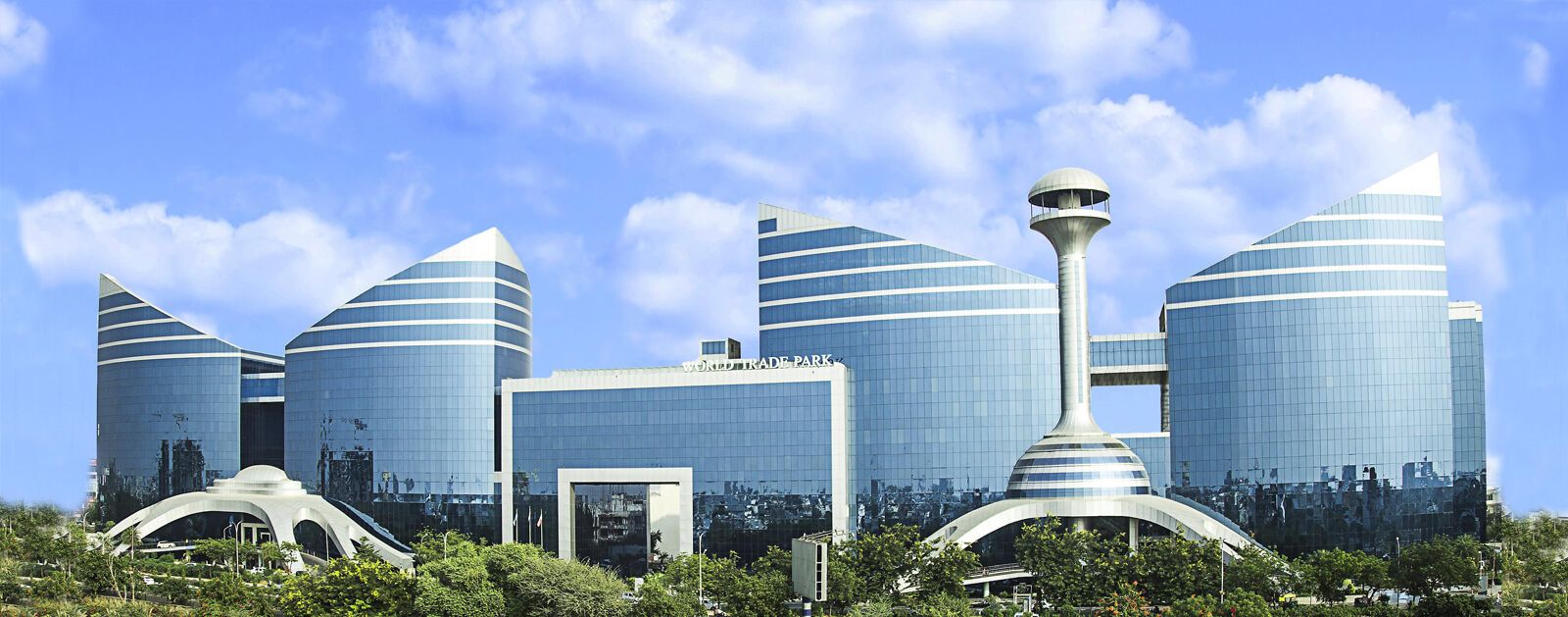 A modern architectural complex with multiple high-rise buildings, a central tower, and a smaller building labeled "WORLD TRADE PARK".