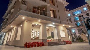 A multi-story building with a prominent sign for 'Amrit Apartments'. - Zade House Jaipur (Jaipur)