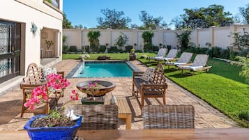 Seasonal outdoor pool, pool umbrellas, pool loungers