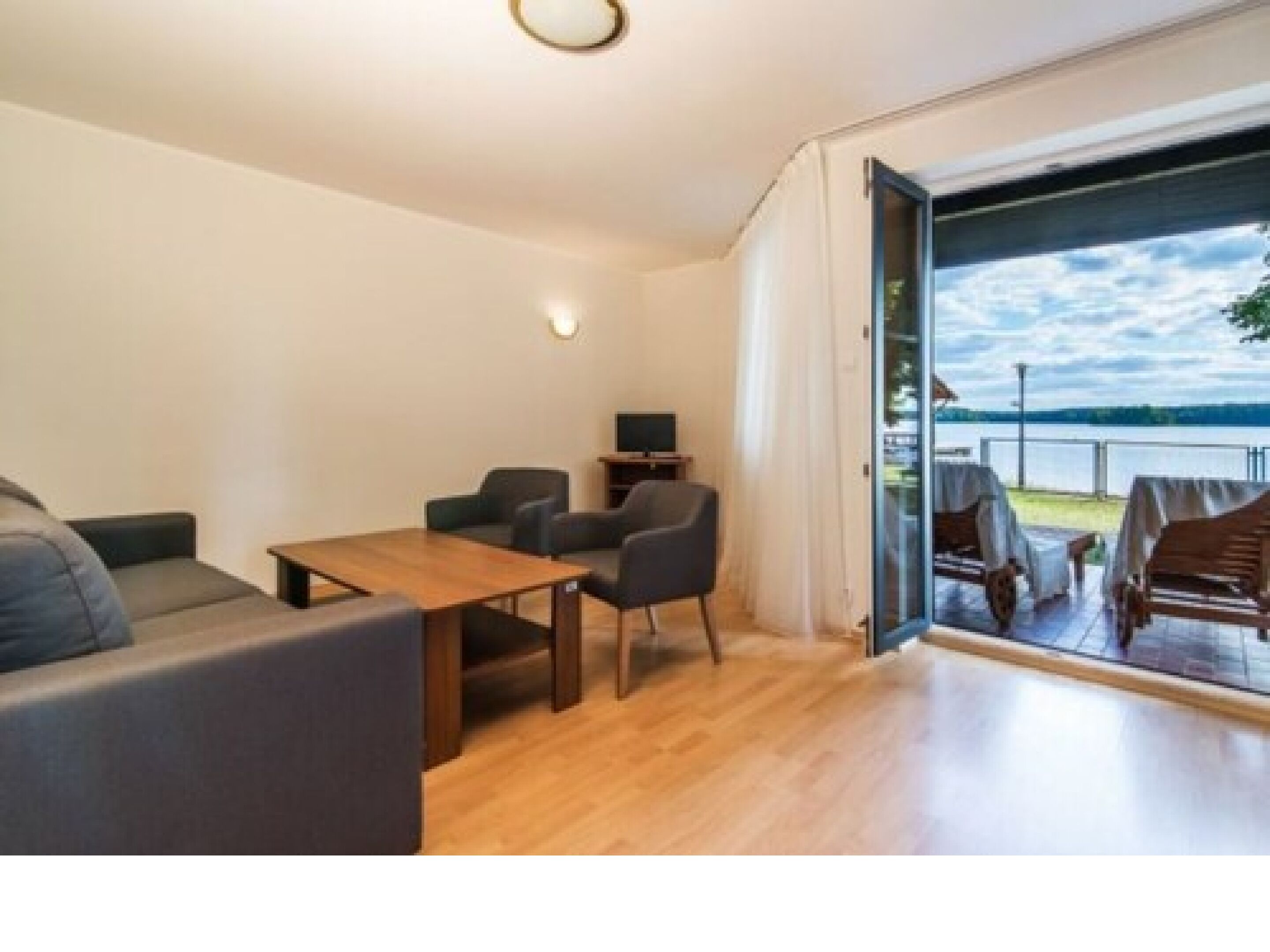 deluxe villa | living area | flat-screen tv, table football, ping pong, toys