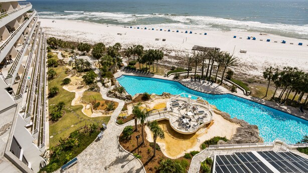 A resort with a pool, beach, and ocean view. - Updated W 700 1 Bedroom 2 Bath Gulf Front Condo with Stunning Views! (Pensacola)